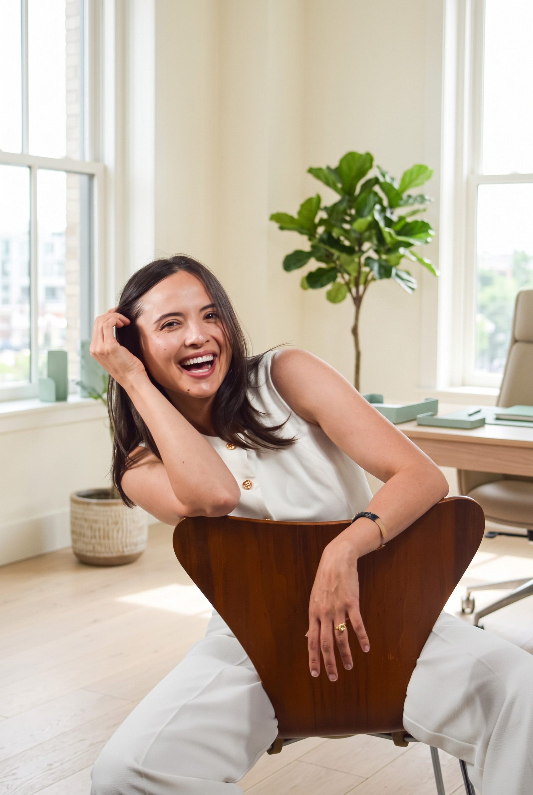 Ashley Gomez laughing in her office
